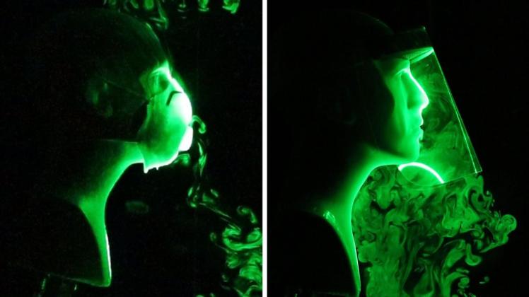 Die Fotos zeigen einen wissenschaftlichen Versuch, bei dem die Strömung künstlich hergestellter Atem-Tröpfchen beim Tragen einer N-95-Gesichtsmaske mit Ausatemventil (l) und einem Gesichtsschild (r) simuliert wird.