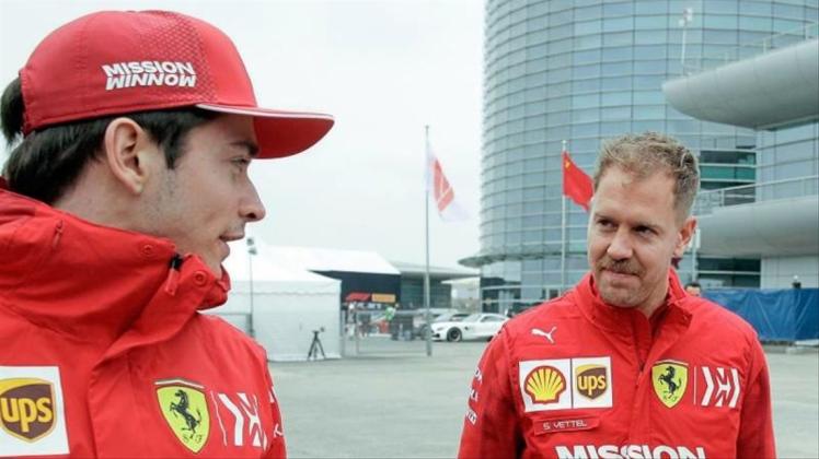 Sebastian Vettel (r) und Charles Leclerc wollen in Monza einen Ferrari-Sieg einfahren. 