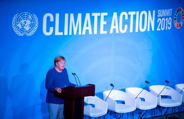 Merkel bei der Klimakonferenz. Foto: AFP/Johannes Eisele