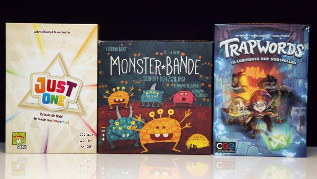 Drei kommunikative Spiele: Just One, Monster-Bande und Trapwords. Foto: Karsten Grosser
