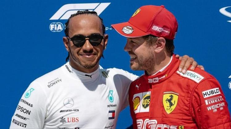 Lewis Hamilton (l) will Sebastian Vettel trotz seines großen Vorsprungs nicht abschreiben. 