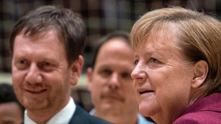 Michael Kretschmer und Angela Merkel besuchen in Görlitz das Siemens-Werk (Archiv). 