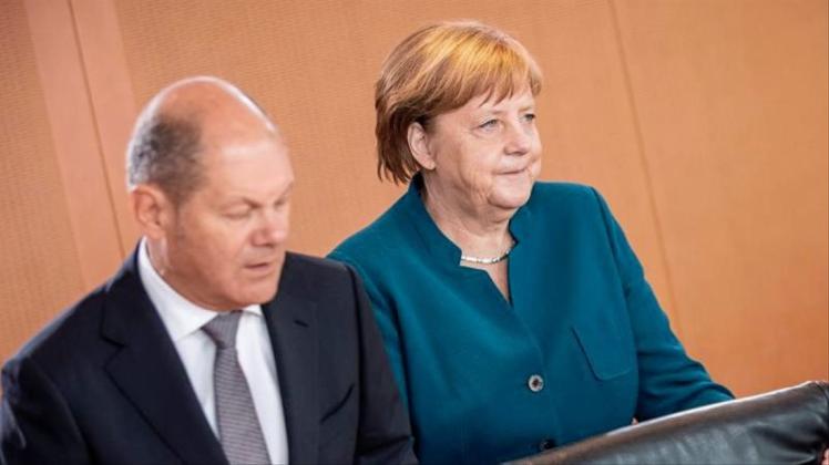 Bundesfinanzminister Scholz zusammen mit Bundeskanzlerin Merkel vergangene Woche vor einer Kabinetssitzung im Kanzleramt. 