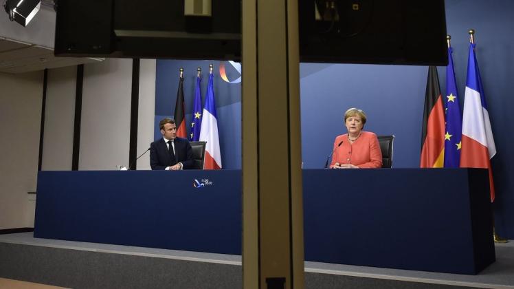 Mission erfüllt? Frankreichs Präsident Emmanuel Macron und Kanzlerin Angela Merkel geben nach dem Ende des Sondergipfels gemeinsam eine virtuelle Pressekonferenz.