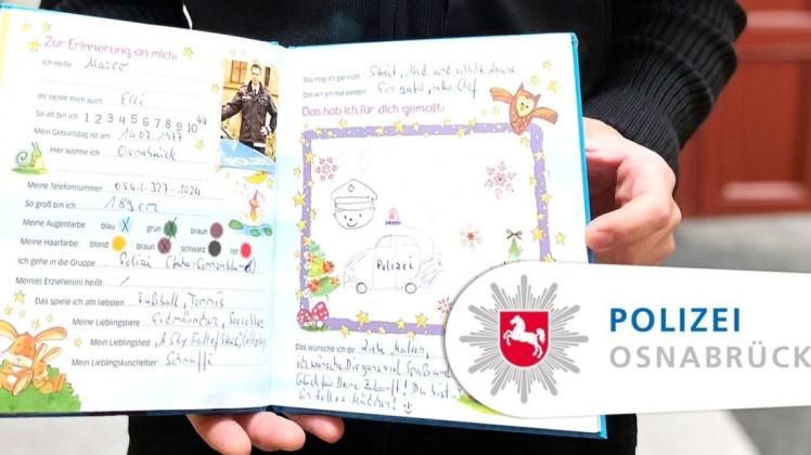 Marco Ellermann von der Polizeidirektion Osnabrück erfüllte der vierjährigen Maleen mit dem Eintrag ins Freundebuch einen Weihnachtswunsch.