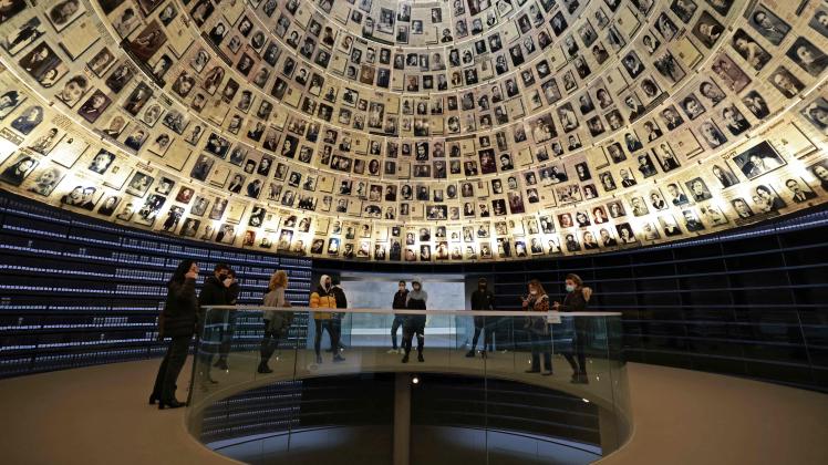 Students visit the Hall of Names, at the Yad Vashem Holocaust Remembrance Centre in Jerusalem on January 26, 2022, on the eve of the International Holocaust Remembrance Day. (Photo by MENAHEM KAHANA / AFP)