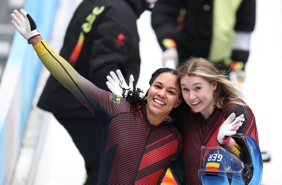 (220219) -- BEIJING, Feb. 19, 2022 -- Laura Nolte (R) and Deborah Levi of Germany celebrate after the bobsleigh 2-woman