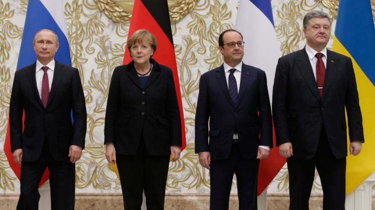 Verhandelten 2015 das Minsker Abkommen: Russlands Präsident Wladimir Putin, Bundeskanzlerin Angela Merkel, Frankreichs Francois Hollande und Ukraines Präsident Petro Poroschenko. 