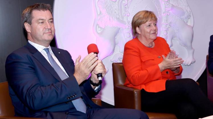 Markus Söder und Angela Merkel beim gemeinsamen Auftritt in München. Foto: Michael Tinnefeld