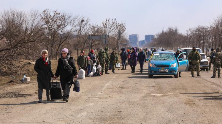 MARIUPOL, UKRAINE   MARCH 18, 2022: Locals leaving the city of Mariupol along a humanitarian corridor. Tension began to