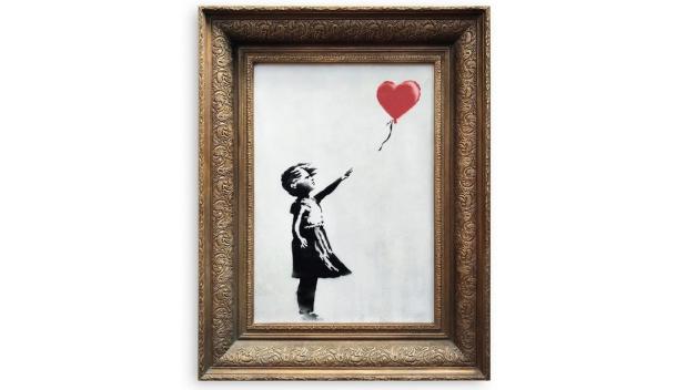 "Girl with Ballon" von Banksy, herausgegeben vom Auktionshaus Sothebys in London. Foto: Sotheby&apos;s/dpa