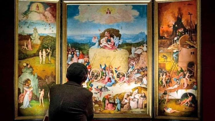 Schaurige Visionen aus der Krisenzeit des späten Mittelalters: Hieronymus Bosch malte mit dem Gemälde „Der Heuwagen“ eine Abrechnung mit den Torheiten seiner Zeitgenossen. 