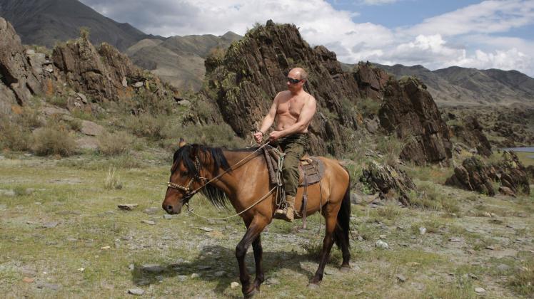 August 4 2009 Republic of Tyva Russia Shirtless Russian Prime Minister VLADIMIR PUTIN rides a