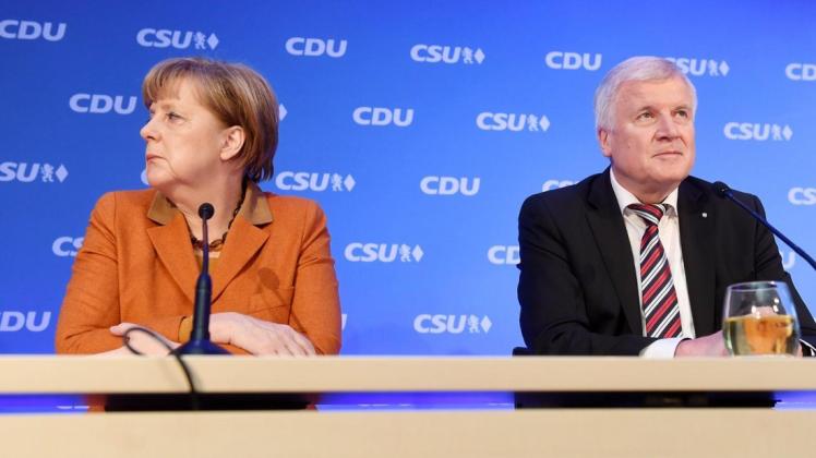 Parteivorsitzende auf Abruf?  Angela Merkel (CDU) und Horst Seehofer (CSU) müssen um ihre Posten bangen. Foto: Tobias Hase/dpa