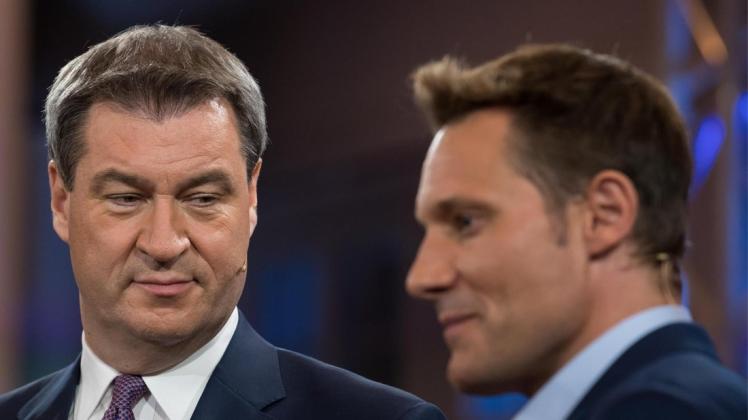 Der bayerische Ministerpräsident Markus Söder (l.) und Ludwig Hartmann von Bündnis 90/Die Grünen stehen sich im TV-Duell zur bayerischen Landtagswahl gegenüber.