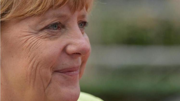 Amüsiert: Angela Merkel beim Gipfel in Brüssel, bei dem sie in ihren 60. Geburtstag hineinfeierte. 