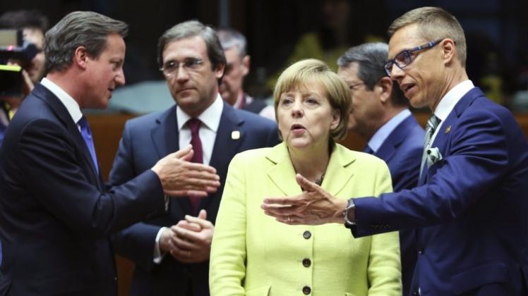 Wer bekommt was? Der britische Premier David Cameron, Portugals Ministerpräsident Pedro Passos Coelho,Bundeskanzlerin Angela Merkel und Finnlands Premierminister Alexander Stubb verhandeln. 