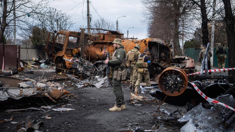 April 6, 2022, Irpin, Ukraine: A soldier film destroyed vehicles and tanks in Irpin, a town near Kyiv that was recently