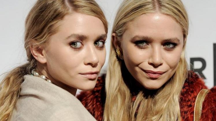 Die US-Zwillinge Mary-Kate (r) und Ashley Olsen brachten armen Kindern in Honduras neues Schuhwerk. Die US-Zwillinge Mary-Kate (r) und Ashley Olsen brachten armen Kindern in Honduras neues Schuhwerk.