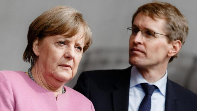 Schleswig-Holsteins Ministerpräsident und die ehemalige Bundeskanzlerin Angela Merkel. /Archiv