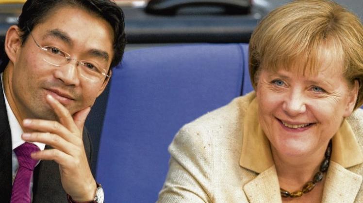 Erleichterung bei Philipp Rösler und Angela Merkel: 523 von 611 Abgeordneten stimmten für ihren Euro-Kurs. 