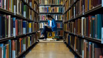 College Student Reading In Library, model released, , 10010110.jpg, 20s, Academics, Adult, Alone, Ambition, Book, Bookca