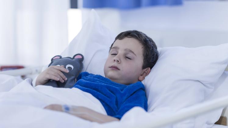Portrait of little boy sleeping in a hospital bed model released Symbolfoto property released PUBLIC