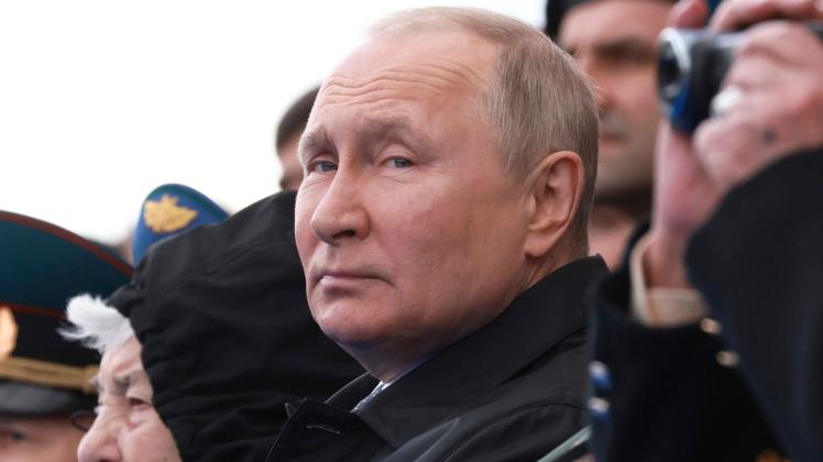 May 9, 2022, Moscow, Moscow Oblast, Russia: Russian President VLADIMIR PUTIN sits in the review stand with veterans at t