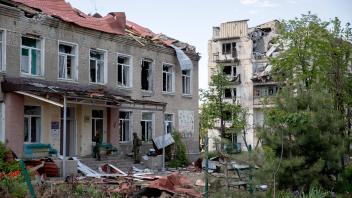 LUGANSK REGION, UKRAINE - MAY 23, 2022: The badly damaged building of Lyceum No.10 in Novotoshkovskoye, which has been