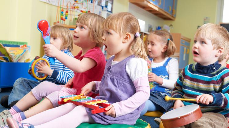 Group Of Pre School Children Taking Part In Music Lesson ,model released, Symbolfoto ,property released PUBLICATIONxINxG
