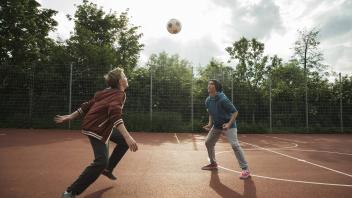 Two boys playing soccer model released PUBLICATIONxINxGERxSUIxAUTxHUNxONLY UUF000756
