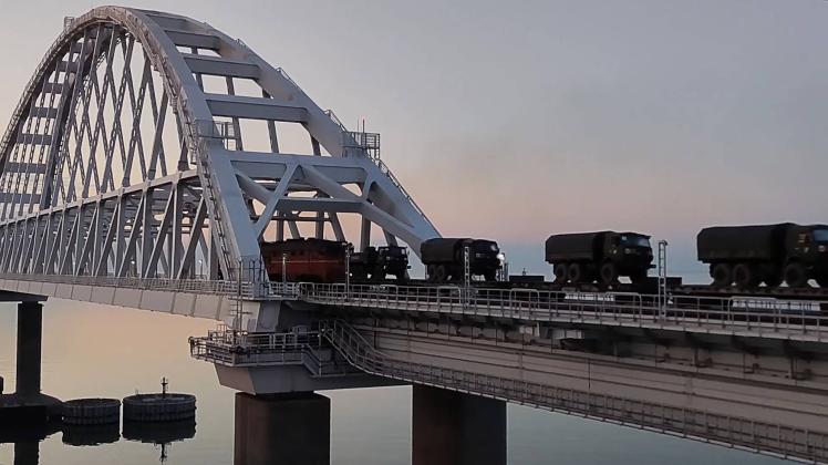 CRIMEA, RUSSIA - FEBRUARY 16, 2022: A troop train crosses Crimean Bridge, carrying Russian military hardware from recen