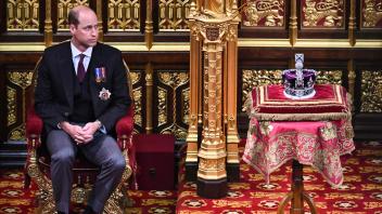 (FILES) In this file photo taken on May 10, 2022 Britain&apos;s Prince William, Duke of Cambridge, sits by the Imperial State Crown, in the House of Lords chamber, during the State Opening of Parliament, at the Houses of Parliament, in London. - Prince William&apos;s 40th birthday this week marks a significant milestone for the future king, who is rapidly stamping his authority on the British royal family by plotting a course between tradition and modernity. (Photo by Ben Stansall / POOL / AFP)