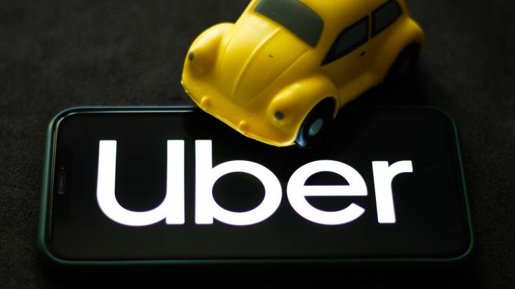Ride-Hailing Apps Photo Illustration Uber logo displayed on a phone screen is seen in this illustration photo taken in K