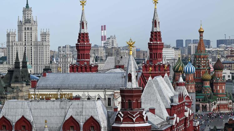 A view shows the State Historical Museum (C), St Basil&apos;s Cathedral (R) and one of the Stalin-era skyscrapers in downtown Moscow on July 11, 2022. (Photo by Kirill KUDRYAVTSEV / AFP)