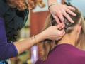 Close up view of stylist fixing up a womans hair in a salon , 22929376.jpg, woman, hairstyle, sophisticated, fixing, str