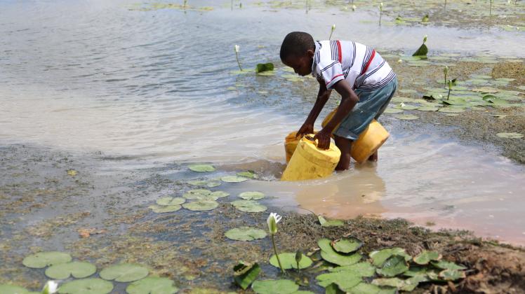 (220615) -- KILIFI, June 15, 2022 -- A boy fetches water in Kidemu sub-location in Kilifi County, Kenya, March 23, 2022.