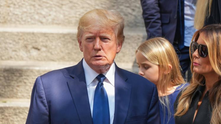 Funeral Held For Ivana Trump In New York City Former President Donald J. Trump, Melania Trump, and Barron Trump exit the