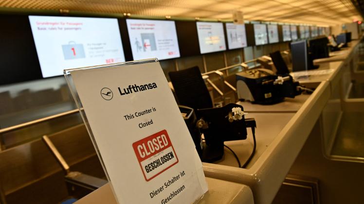 (FILES) This file photo taken on June 11, 2020 shows a closed check-in desk of German airline Lufthansa at Berlin’s Tegel Airport. - German national carrier Lufthansa is braced for further travel upheaval as the country&apos;s powerful Verdi union called on ground crew to strike on July 27, 2022 in a row over higher wages. The stoppage from 0145 GMT on July 27 until 0400 GMT on July 28 will cause "major flight cancellations and delays", Verdi warned on Monday, July 25. The walkout at one of Europe&apos;s largest airlines adds to a troubled summer season at airports across the continent as eased coronavirus restrictions have boosted tourism demand, but chronic staff shortages have left passengers grappling with flight disruptions, long queues and lost luggage. (Photo by Tobias SCHWARZ / AFP)
