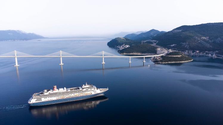 Aerial photos of a cruiser passing under the Peljesac Bridge Aerial photos of the passage of the first large cruiser und