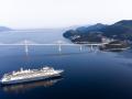 Aerial photos of a cruiser passing under the Peljesac Bridge Aerial photos of the passage of the first large cruiser und