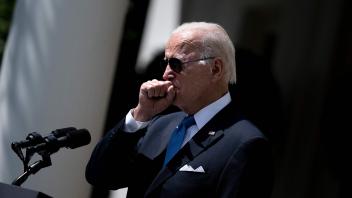 (FILES) In this file photo taken on July 27, 2022, US President Joe Biden coughs while delivering remarks in the Rose Garden of the White House in Washington, DC. - US President Joe Biden tested positive for Covid-19 for a second time and is returning to isolation though he "continues to feel quite well," his White House doctor said on July 30, 2022. (Photo by Brendan Smialowski / AFP)