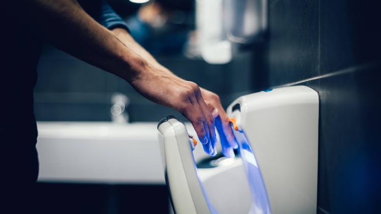 close up. man disinfecting his hands in the bathroom close up. man disinfecting his hands in the bathroom . hygiene and