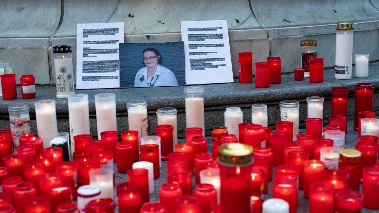 linz, austria, 01 aug 2022, flowers and burning candles lie at a memorial in memory of upper austrian doctor Lisa-Maria