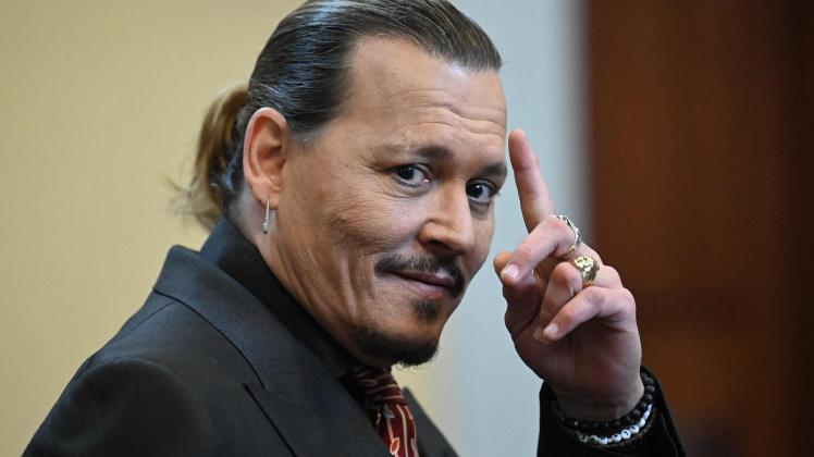 (FILES) In this file photo taken on May 03, 2022 US actor Johnny Depp looks on during a hearing at the Fairfax County Circuit Courthouse in Fairfax, Virginia. - Fresh off his highly publicized, controversial defamation suit, actor Johnny Depp is set to release an album with English rocker Jeff Beck on July 15, a statement released June 9, 2022 said. (Photo by JIM WATSON / POOL / AFP)