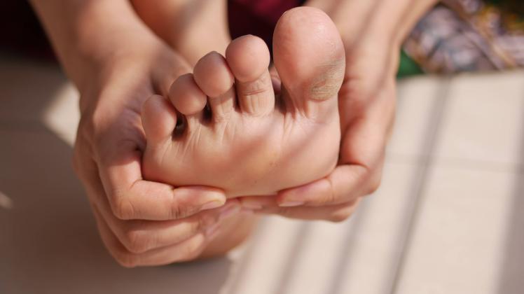 Close up on women feet and hand massage on injury spot. Close up on women feet and hand massage on injury spot Copyright