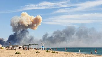 CRIMEA, RUSSIA   AUGUST 9, 2022: Smoke rises after an explosion near the village of Novofedorovka. The Saki air base use