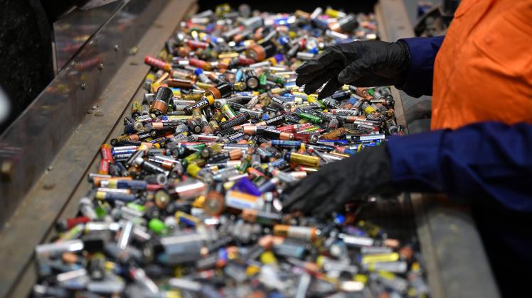 ENVIRONMENT BATTERIES FEATURE, Workers sort batteries for recycling at Envirostream Australia in Melbourne, Monday, Febr