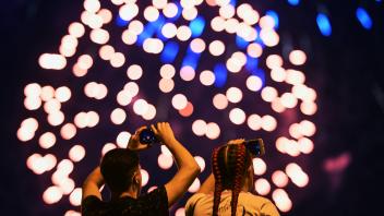Russia Fireworks Festival 8253172 14.08.2022 People watch fireworks during the Rostec International Fireworks Festival
