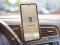 Augsburg, Bavaria, Germany - May 24, 2021: Google Maps navigation on smartphone while driving a car.